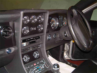 <span class="light">2001</span> Bentley Continental R Mulliner Le Mans Piano Black with chrome instrument bezels.